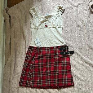 Plaid Red Skirt and cute sleeveless velvet top with heart accent.